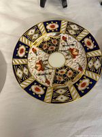 Front view of one Imari plate showing pattern and colors