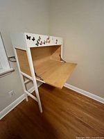 Front view closed showing white frame, butterfly stickers