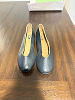 Top view of pair of black leather flats