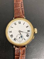 Front view showing dial, case and strap