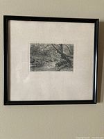 Full view of framed etching on wall