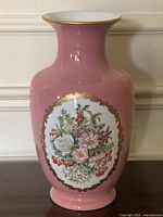 Full view of pink porcelain vase with floral medallion