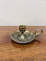 Oblique view showing overall form, handle, dragon relief