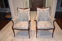 Front view of both side chairs showing wood frames and upholstery
