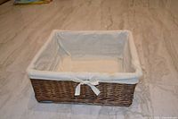 Overall view of rectangular wicker basket with liner