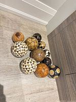 Group of patterned decorative spheres on floor