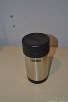 Front view of stainless steel Thermos jar with lid on