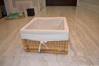 Front view of square wicker basket with liner