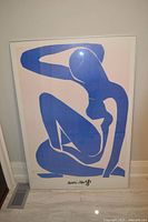 Framed Matisse Blue Nude II print leaning against wall