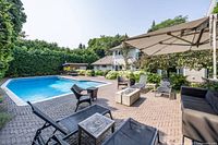 Poolside view showing multiple lounge chairs
