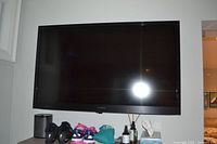 Front view of Sony flat panel TV mounted on wall