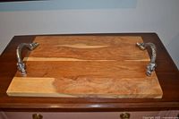 Top view of the wooden tray showing entire surface and both metal handles
