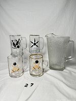 Group view: ribbed pitcher and four bowling beer mugs