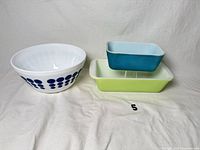 All three Pyrex pieces grouped: blue-dot bowl, turquoise refrigerator dish, green divided casserole