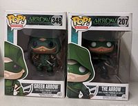 Front view of both Funko Pop boxes showing characters and numbers