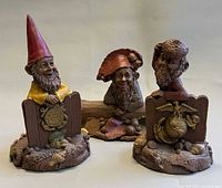 Group shot of the three Tom Clark gnome sculptures
