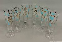 All six pilsner glasses in a row