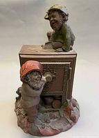 Front view of Tom Clark gnome sculpture showing two gnomes and safe detail