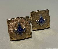 Front view showing Masonic emblems on both cufflinks