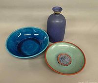 Group shot showing all three pottery pieces: blue vase, turquoise bowl, green Roman glass dish
