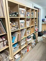 Front view showing entire 5x5 cube shelving unit with contents for scale