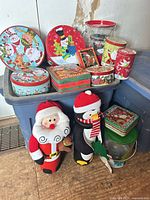 Group shot showing all tins, bucket and bottle covers