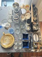 Overhead view of entire assortment showing candles, holders, tray, snuffer, wick trimmer and boxed tapers