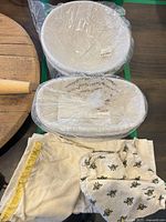 baskets wrapped in plastic with liners and cloths shown