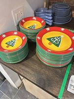 Stacked dinner plates, side plates and bowls showing pattern