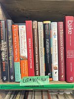 Shelf showing all 11 cookbook spines