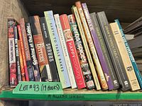 Entire shelf showing all 19 cookbook spines with lot tag
