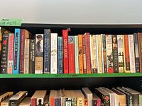 Full shelf view showing all 27 paperbacks