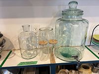 Group view of beverage dispenser, two jars, and two tumblers
