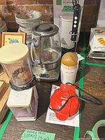 All five appliances grouped on tabletop showing general condition