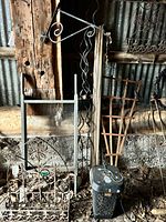 Group shot of metal trellises, wall planter, wooden trellis, bug zapper