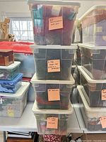 Stack of clear tubs filled with skeins of yarn