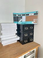 Overall lot showing paper stack, 6-drawer unit, four packaged wall manager panels