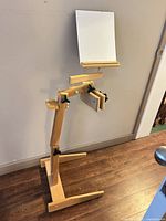 Front view of adjustable wooden floor easel