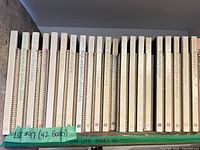 Full shelf view showing all 42 spiral-bound recipe books