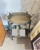 Overall view of two-tier brass tray cart with accessories