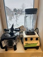Vita-Mix blender base, jar, Ninja processor bowl and cups