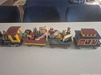 Full view of four-car wooden Christmas train set