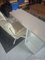 Desk and chair overview showing desk shelf side and chair