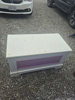 Closed toy chest front and top view