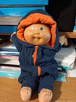 Front view of 12-inch Cabbage Patch Kids Preemie doll in blue hooded suit