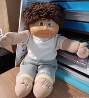 Front view of 16-inch Cabbage Patch Kids doll seated