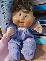 Front view of 14" Cabbage Patch Kids doll wearing lavender sleeper