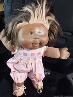 Full view of doll standing, showing outfit and hair