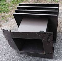 Louvered metal roof vent showing interior and multiple blades