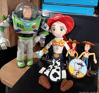 Group shot of Buzz Lightyear figure, Jessie plush, two Woody figures and yo-yo
